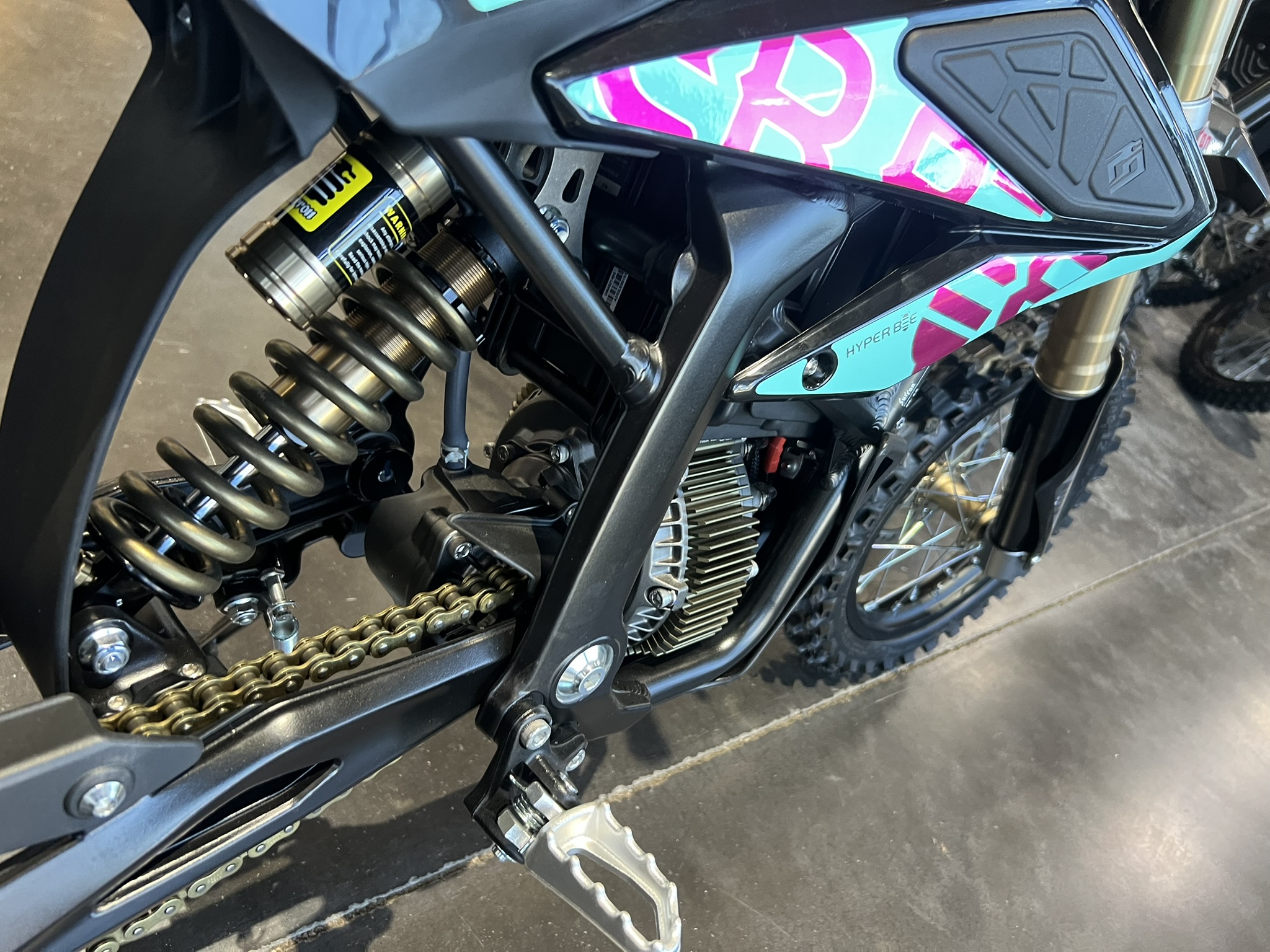 blue surron hyper bee graphics / rear shock