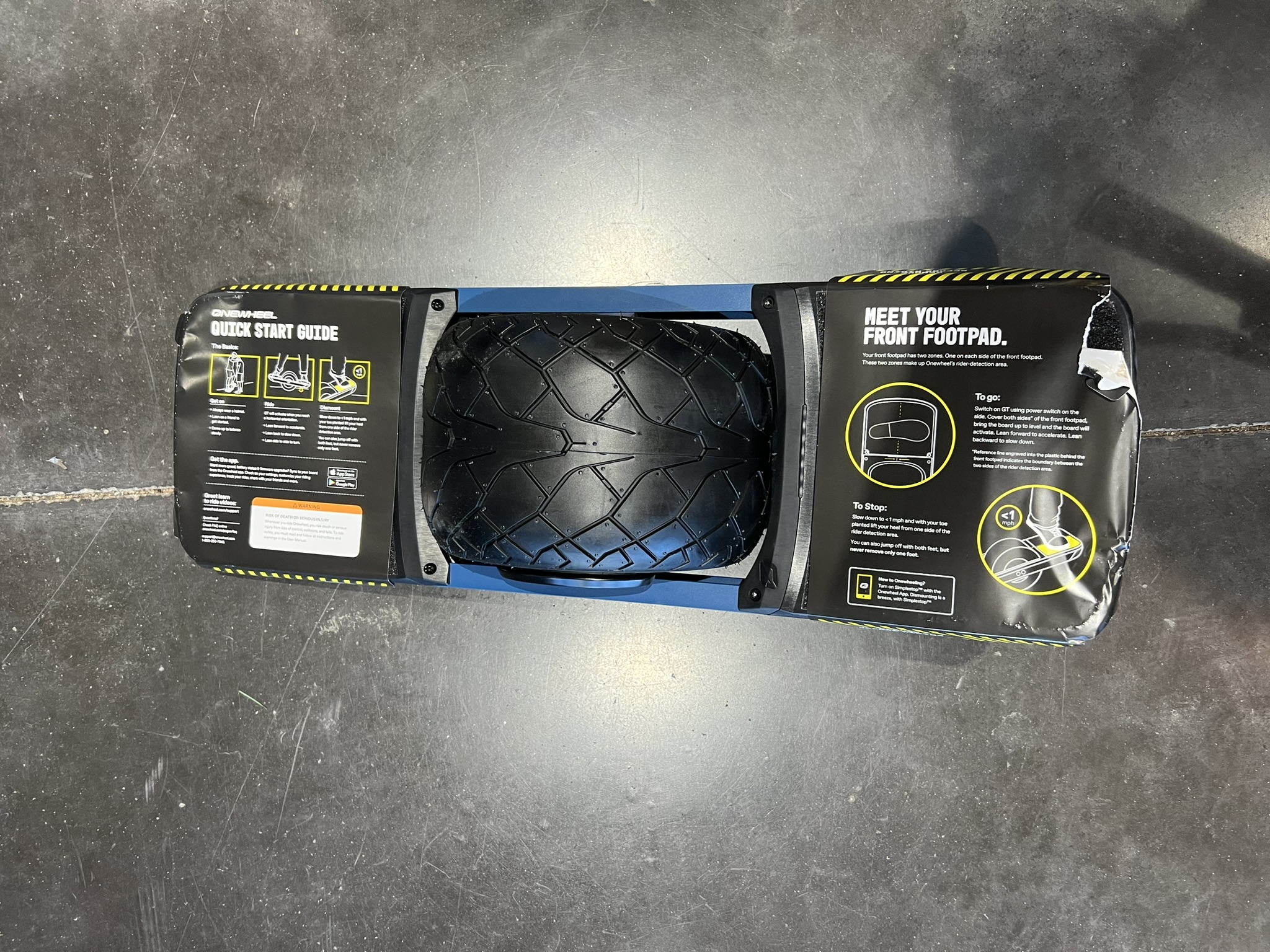 onewheel classic xr view from above tire tread and specs written on the labels