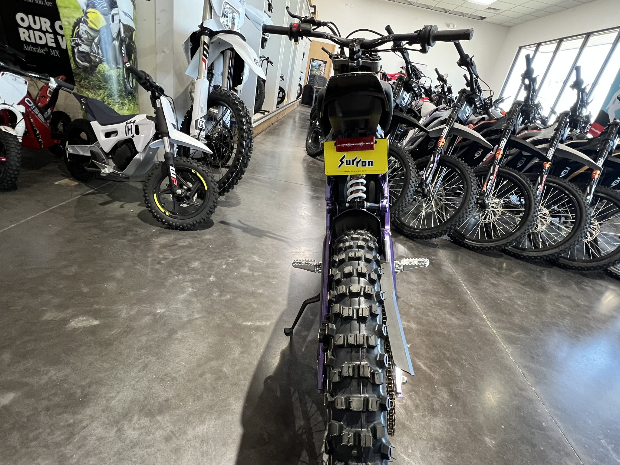 25 surron lbx purple rear end view