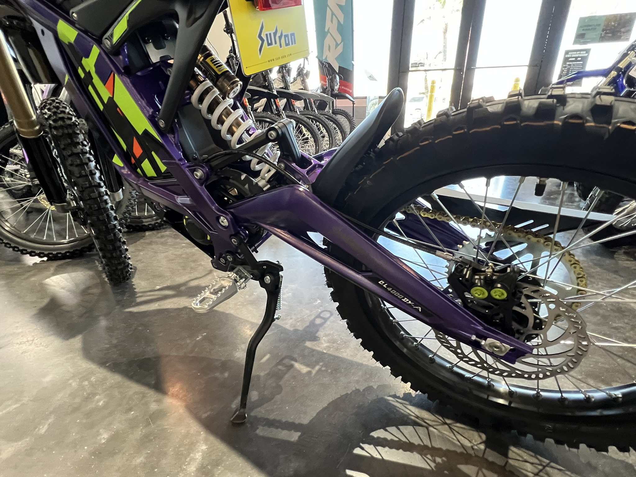 25 surron lbx purpleleft side kick stand