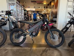 talaria xxx black with off road tires side profile.